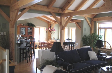 The structural beams are part of the rustic "look" of the finished house.