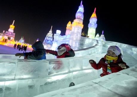 Children enjoying the slides at the Harbin Ice Festival in China. Photo from www.mymodernmet.com 